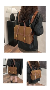 Detail view of brown matte vintage backpack with adjustable straps and metal buckles
