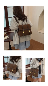 Detailed view of brown matte vintage briefcase backpack with gold buckles and straps