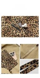 Detail view of leopard print canvas tote featuring internal pocket and brand logo tag