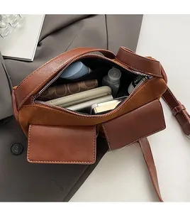 Top view of spacious interior and pockets of a brown vintage leather crossbody bag