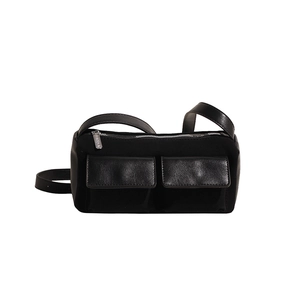 Minimalist black baguette bag with faux leather pockets and adjustable shoulder strap