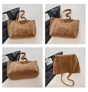 Vue détaillée du grand sac cabas en toile marron avec rivets argentés et style rétro chic