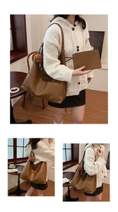 Close-up of brown faux leather tote bag with matching pouch and bear charm in a cafe