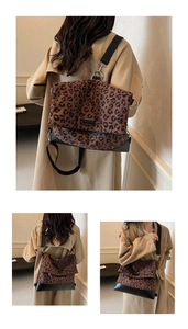 Detailed view of leopard print shoulder bag with wide strap and silver metal hardware