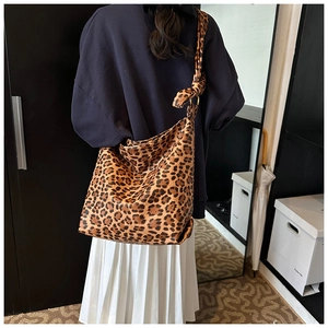 Detail of leopard print tote bag featuring a stylish knotted shoulder strap and large capacity