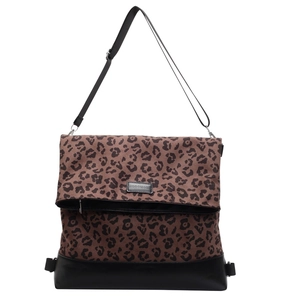 Close-up of leopard print canvas tote bag featuring foldable top and black brand logo
