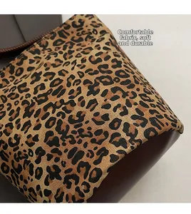 Close-up of leopard print fabric texture with soft and durable brown leather base