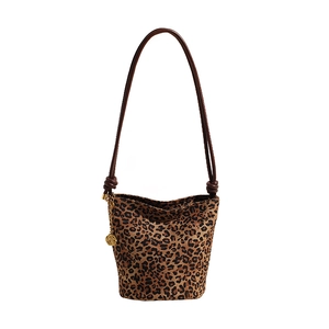 Vintage leopard print bucket bag with brown leather strap and golden logo charm