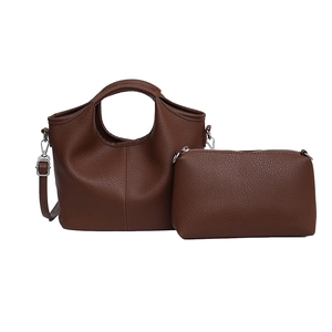 Dark brown pebble leather bucket bag set with cutout handle and matching pouch