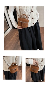 Detailed view of brown quilted suede box bag with woven chain strap and top handle