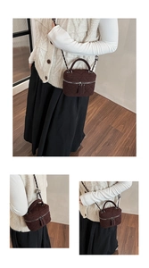 Detail of dark brown quilted suede box bag with silver chain and dual zippers