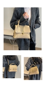 Detail of apricot crossbody bag with golden oval lock and versatile carrying straps