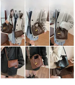 Detail view of stylish bucket bags in dark brown, tan, and black with gold chain straps