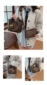 Close-up of vintage dark brown PU leather bucket bag set with gold chain and pendant