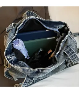 Detail view of denim tote bag with spacious interior for tablet, umbrella, and makeup
