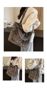 Detailed view of washed denim tote bag featuring external pockets and metallic zippers