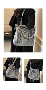 Detail view of washed denim tote bag showing multi-strap design and vintage texture