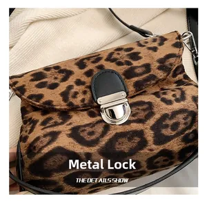 Close-up of elegant silver hardware buckle and leopard print faux fur texture on bag