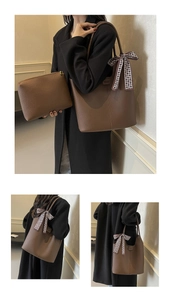 Detail of brown tote bag set with a checkered bow and matching zipper pouch