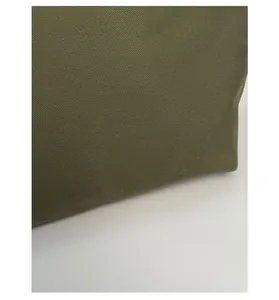 Detailed macro shot of durable military green twill fabric texture for stylish handbags