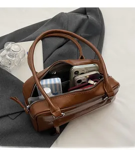 Top view of brown Boston bag interior showing spacious capacity for daily essentials