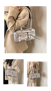 Detailed view of silver metallic PU bowling bag featuring chic bow accents and dual pockets