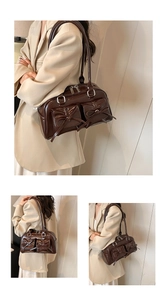 Detail of dark brown glossy PU leather bag with bow pockets and silver zippers
