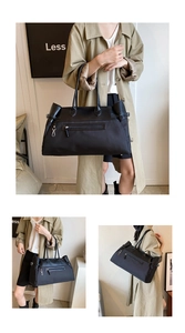 Detail of black tote bag with leather handles and zip pockets for commuting