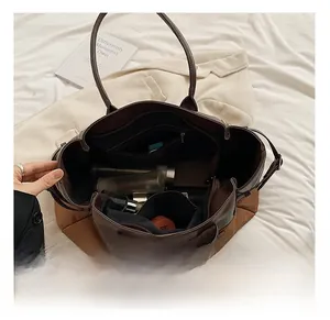 Detailed interior of the large tote bag showing compartments and spacious storage capacity