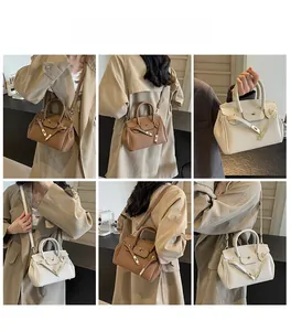 Multiple views of a vintage pebble leather handbag with classic metal belt buckle closure
