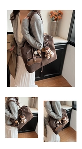 Detail of a brown frosted suede tote bag featuring a cute bear plush and glasses pouch