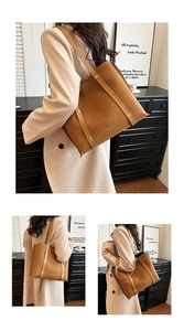Macro detail of brown suede tote bag with golden rivets and smooth leather shoulder straps