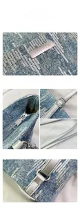 Detail view of denim tote bag with silver sequins, metal logo and zipper closure