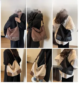 Detail view of large tote bags with suede texture, leather corners, and adjustable straps