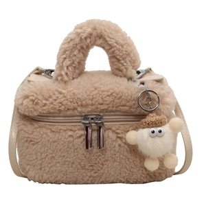 Beige faux shearling crossbody bag with top handle and cute plush charm pendant