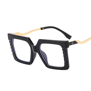 Oversized black square glasses frame with gold metal temples and quilted texture detail