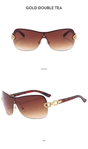 Detail view of Y2K rimless sunglasses with gold chain temples and gradient tea lenses