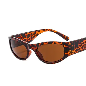 Y2K futuristic leopard print sunglasses with dark brown lenses and wrap frame style