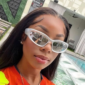 Futuristic silver Y2K sports sunglasses with metallic fluid frames and reflective lenses