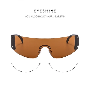 Detail view of Y2K rimless star sunglasses with silver rivets and amber lenses
