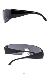 Detail view of Y2K star sunglasses with sleek black frame and metallic accents