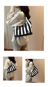 Detail of striped PU tote bag featuring a decorative black bow and spacious interior