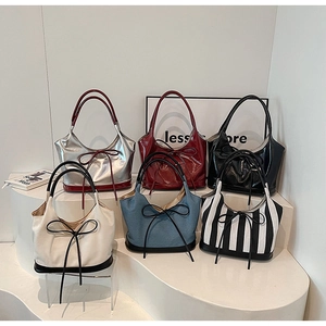 Collection of PU leather bow tote bags in silver, burgundy, denim, and striped designs