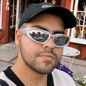 Y2K punk cycling sunglasses with silver mirror lenses and wraparound futuristic frames