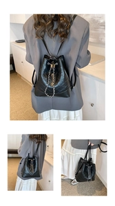 Black quilted drawstring bucket bag shown in multiple carrying styles for students