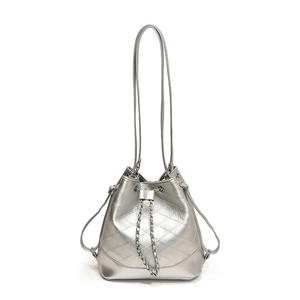 Silver metallic quilted bucket bag with chain drawstring and modern shoulder straps