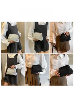 Detailed views of shimmering rhinestone evening clutch bags in silver and black colors