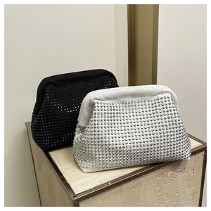 Detailed close-up of crystal rhinestones on luxury evening clutch bags in silver and black