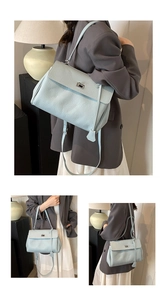 Detail of mint green pebble leather shoulder bag with silver turn-lock and adjustable strap