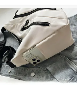 Close-up of durable nylon tote bag side pocket holding a smartphone for storage